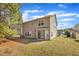 The backyard is spacious, offering a large grassy area, mature trees and a convenient concrete patio at 3100 Cynthiana Ct, Raleigh, NC 27610