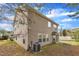 Exterior back of the home, with a small patio and windowed porch at 3100 Cynthiana Ct, Raleigh, NC 27610
