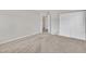 A neutral bedroom with carpet, closet and doorway offering plenty of space at 3100 Cynthiana Ct, Raleigh, NC 27610