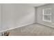 Neutral bedroom with carpet, bright window and plenty of open space at 3100 Cynthiana Ct, Raleigh, NC 27610