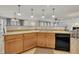 Well-equipped kitchen with seamless countertops, modern appliances, wooden cabinets, and an open layout at 3100 Cynthiana Ct, Raleigh, NC 27610