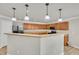Bright kitchen features wooden cabinets, modern appliances, an open layout, and ample countertop space at 3100 Cynthiana Ct, Raleigh, NC 27610