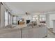 Spacious living room with a fireplace, plush sofa, and abundant natural light at 3100 Cynthiana Ct, Raleigh, NC 27610