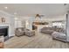 Spacious living room showcases wood floors, fireplace, and open layout connecting to kitchen and dining areas at 3100 Cynthiana Ct, Raleigh, NC 27610