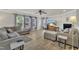 Bright living room with neutral walls, wood floors, fireplace, and ample seating, perfect for relaxation at 3100 Cynthiana Ct, Raleigh, NC 27610