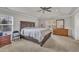 Serene main bedroom with tray ceilings, a large bed, and a cozy atmosphere at 3100 Cynthiana Ct, Raleigh, NC 27610
