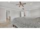 Well-lit main bedroom featuring plush carpeting, and a ceiling fan at 3100 Cynthiana Ct, Raleigh, NC 27610