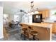 Open concept kitchen and dining area with breakfast bar and seating at 3130 State Hwy 58, Louisburg, NC 27549