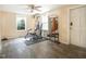 Exercise room featuring workout equipment, windows, and ceiling fan at 3130 State Hwy 58, Louisburg, NC 27549