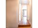 Hallway with wood flooring and doorways leading to other rooms at 3130 State Hwy 58, Louisburg, NC 27549