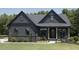 Charming two-story home featuring a manicured lawn and inviting front porch at 33 Henry Ct, Chapel Hill, NC 27516