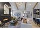 Inviting living room featuring a fireplace, vaulted ceilings, exposed beams and an open-concept design at 33 Henry Ct, Chapel Hill, NC 27516