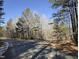 A tree lined intersection showing road leading to a beautiful property at 33 Henry Ct, Chapel Hill, NC 27516