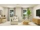 Bright living room features a comfortable sectional sofa and neutral decor for a relaxing atmosphere at 3725 Massey Pond Trl, Raleigh, NC 27616