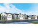 Street view featuring new construction homes with neutral color schemes and well-manicured lawns at 3725 Massey Pond Trl, Raleigh, NC 27616