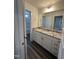 Bathroom features a vanity with granite countertop and ample storage space at 405 Rising Star Dr, Clayton, NC 27520