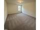 Bedroom with plush carpet and large window at 405 Rising Star Dr, Clayton, NC 27520