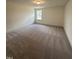 Bright, neutral bedroom with carpeting, base molding and a single window for ample natural light at 405 Rising Star Dr, Clayton, NC 27520