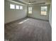 Bright and airy bedroom featuring plush carpet and ample natural light for creating a comfortable and inviting space at 405 Rising Star Dr, Clayton, NC 27520