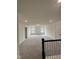Large bonus room with two windows and plush carpet, perfect for entertaining or relaxation at 405 Rising Star Dr, Clayton, NC 27520