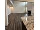 Open-concept living room, showcasing hardwood floors and a fireplace, seamlessly connecting the kitchen and dining area at 405 Rising Star Dr, Clayton, NC 27520