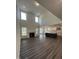 Sun-filled living room with high ceilings, fireplace, and connecting kitchen, creating an inviting and spacious living area at 405 Rising Star Dr, Clayton, NC 27520