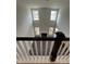 The open living room boasts soaring ceilings, abundant natural light, and a cozy fireplace at 405 Rising Star Dr, Clayton, NC 27520