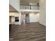 Spacious living area featuring hardwood floors, high ceilings, and modern staircase to the upstairs, open layout at 405 Rising Star Dr, Clayton, NC 27520