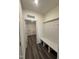 Functional mudroom with a bench, coat hooks, and easy access to the laundry room for convenience at 405 Rising Star Dr, Clayton, NC 27520