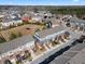 Aerial view of townhomes in a neighborhood showcasing mature trees, landscaping, and streetscape at 4116 Sykes St, Cary, NC 27519