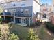 Multi-level outdoor living with patios and decks and a lush, landscaped yard at 4116 Sykes St, Cary, NC 27519