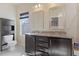 Modern bathroom with double sinks, dark cabinetry, and a granite countertop at 4116 Sykes St, Cary, NC 27519