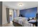 Bedroom featuring a queen bed and blue accent wall at 4116 Sykes St, Cary, NC 27519