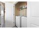 Bright laundry room featuring a modern washer and dryer at 4116 Sykes St, Cary, NC 27519