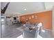 Open-concept living room featuring gray furnishings, a dining area, and modern decor at 4116 Sykes St, Cary, NC 27519
