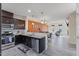 Open-concept kitchen with stainless steel appliances, a dining area, and connected living room at 4116 Sykes St, Cary, NC 27519