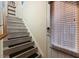 Staircase featuring carpet treads and a modern gray finish at 4116 Sykes St, Cary, NC 27519