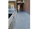 Exterior view of a brick building, showcasing a walkway with railing and stairs at 500 Umstead Dr # 105D, Chapel Hill, NC 27516