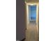 Hallway with hardwood floors connecting various rooms, offering a clear view of the layout at 500 Umstead Dr # 105D, Chapel Hill, NC 27516