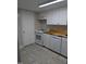Kitchen featuring white cabinets, wooden countertops, and modern appliances including an oven and dishwasher at 500 Umstead Dr # 105D, Chapel Hill, NC 27516