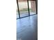 Spacious living room featuring hardwood floors, large glass sliding doors, and a view of the backyard at 500 Umstead Dr # 105D, Chapel Hill, NC 27516