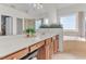 Bright bathroom featuring double vanity, large mirror, jacuzzi tub, and plenty of natural light at 505 Redford Place Dr, Rolesville, NC 27571