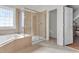 Clean bathroom featuring a tub, a glass enclosed shower, and tile floors at 505 Redford Place Dr, Rolesville, NC 27571