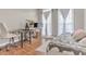 Well-lit bedroom with a desk and chair, bed and bright windows at 505 Redford Place Dr, Rolesville, NC 27571