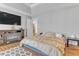 Bedroom featuring a large bed, a TV, and a decorative fireplace at 505 Redford Place Dr, Rolesville, NC 27571