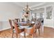 Dining room area featuring hardwood floors and an elegant chandelier at 505 Redford Place Dr, Rolesville, NC 27571