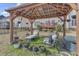 Gazebo in the backyard offers a relaxing space with chairs and views of the house at 505 Redford Place Dr, Rolesville, NC 27571
