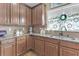 Updated kitchen features stainless appliances, granite countertops and decorative window at 505 Redford Place Dr, Rolesville, NC 27571