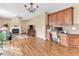 Comfortable living room with fireplace, wood floors, and built-in desk and storage space at 505 Redford Place Dr, Rolesville, NC 27571