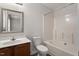 Well-lit bathroom featuring a shower-tub combo, toilet, and vanity with a mirror at 650 Ganyard Farm Way # 4, Durham, NC 27703